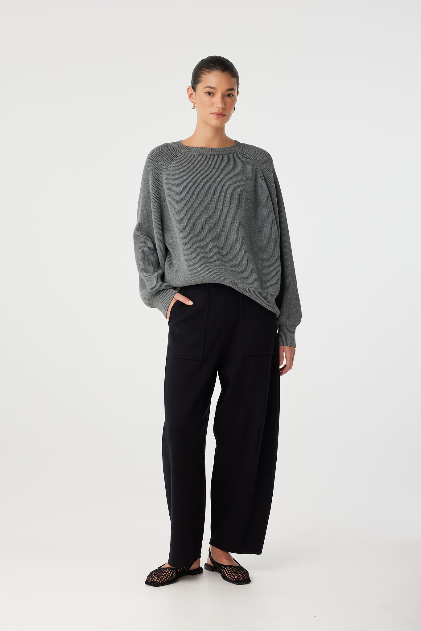 Casual styling of Emery Sweater with soft drape and slouchy fit, ideal for layering.