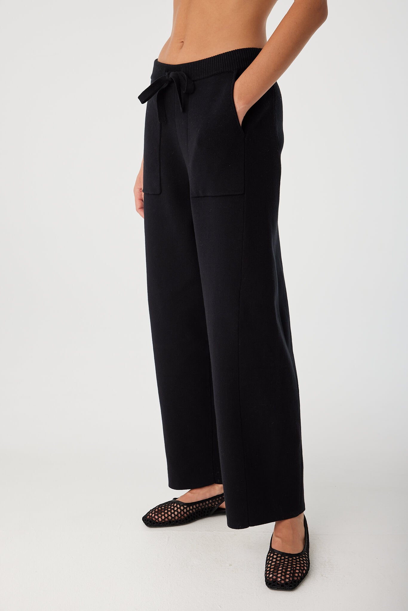 Side view of Rylan Pant showing panelled leg detail and relaxed silhouette.