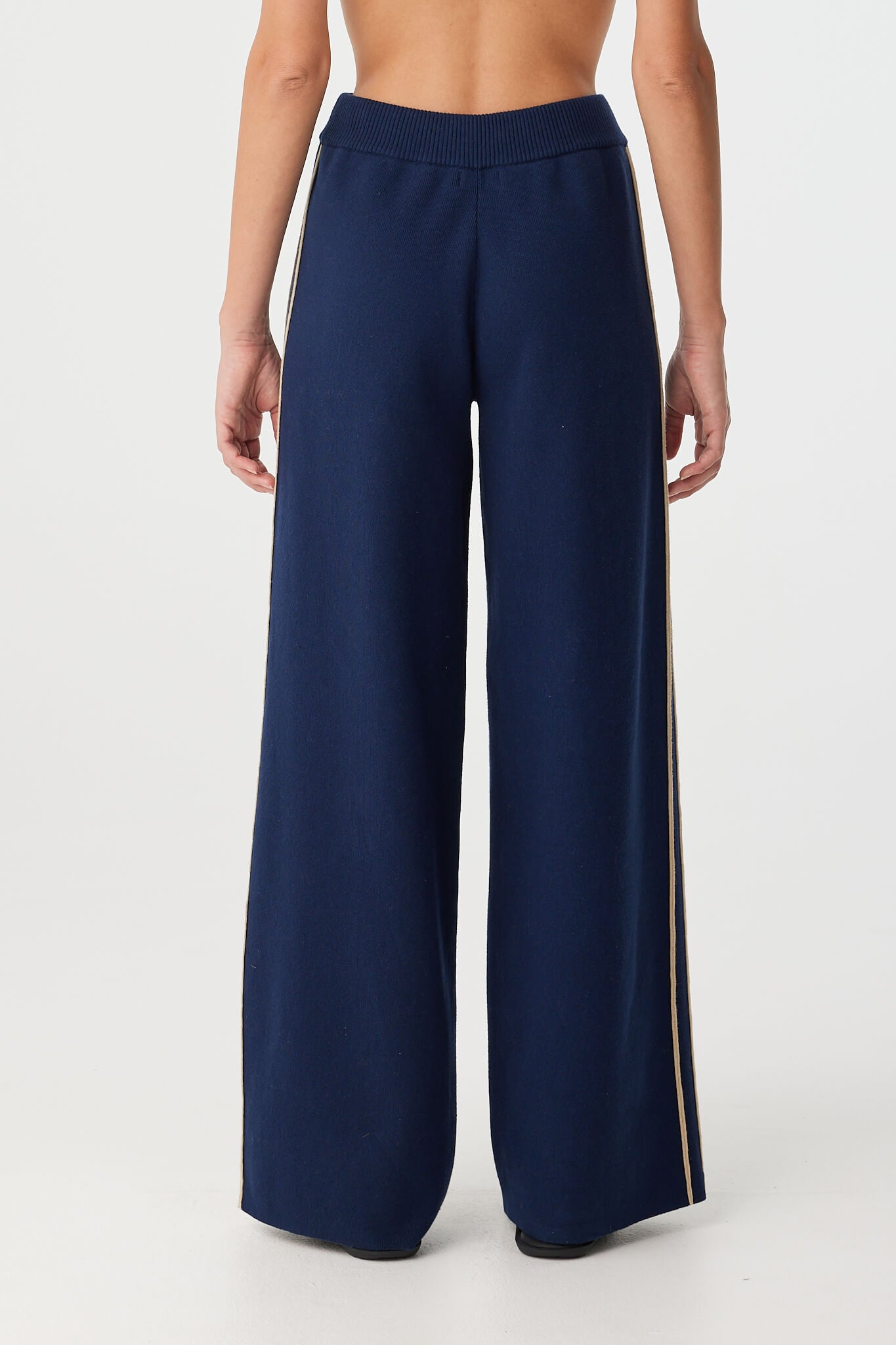 Back view of full-length pant with clean leg line and relaxed fit.