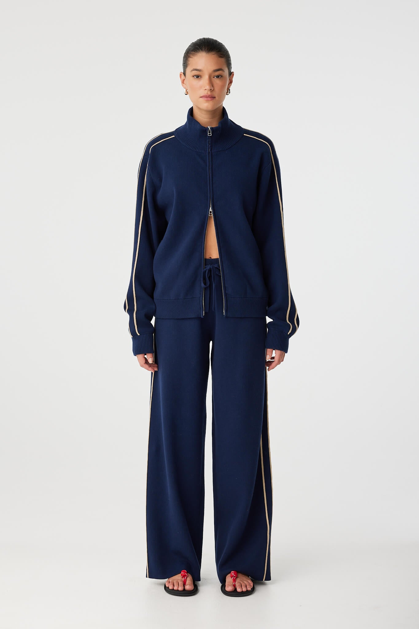 Full view of wide leg navy pant in organic cotton blend, styled for relaxed movement.