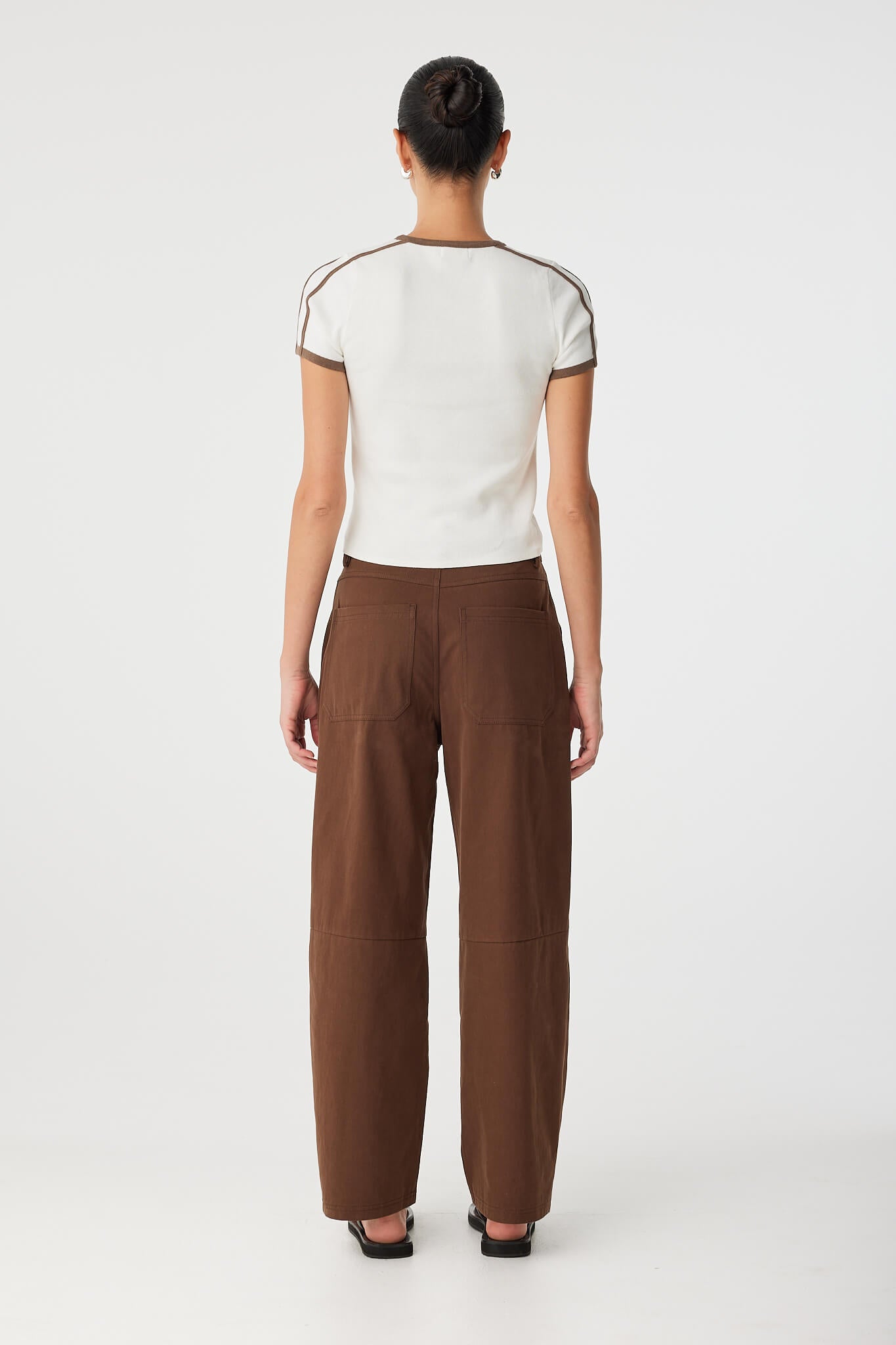 Back view of cream and cacao stripe tee with slim fit and sleeve detail.