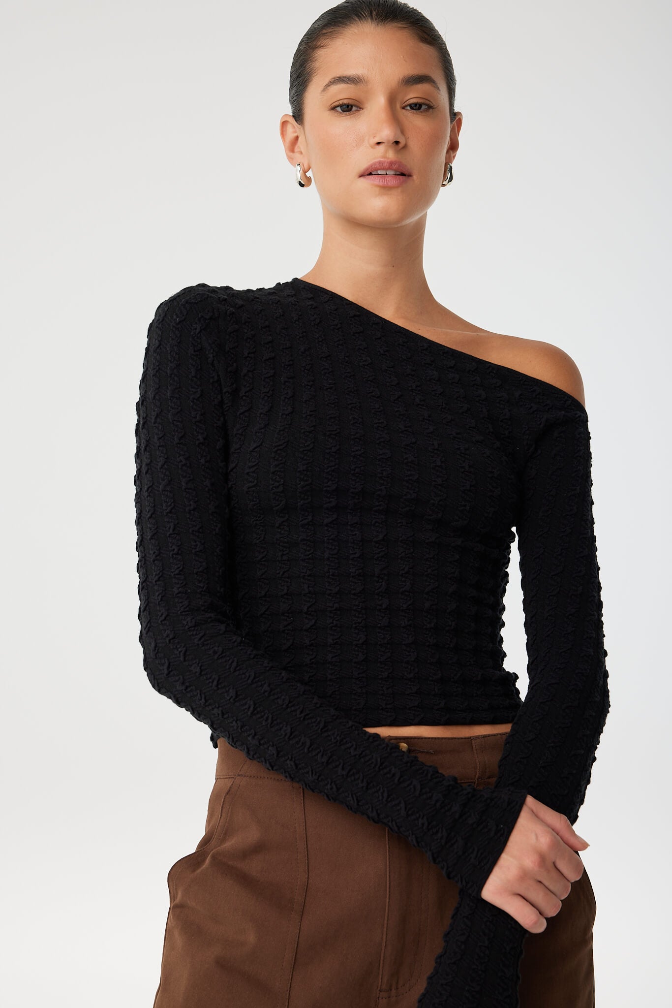 Close-up of jacquard texture and asymmetric line in stretch organic cotton knit.