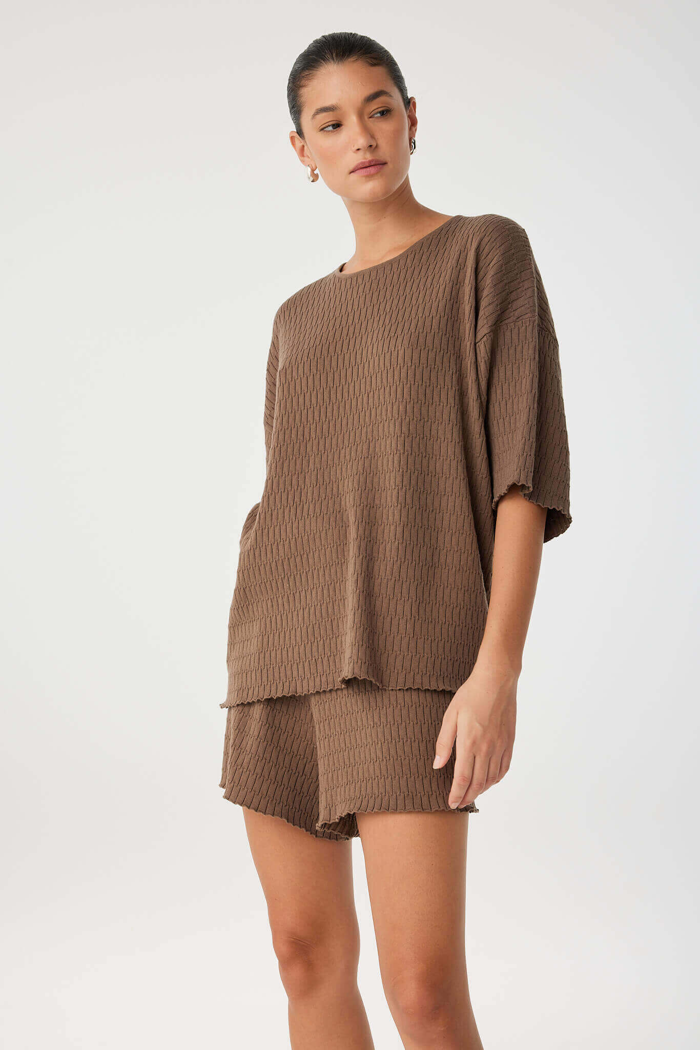 Relaxed knit set with oversized tee and matching shorts in cacao cotton, capturing a modern, textural loungewear look.