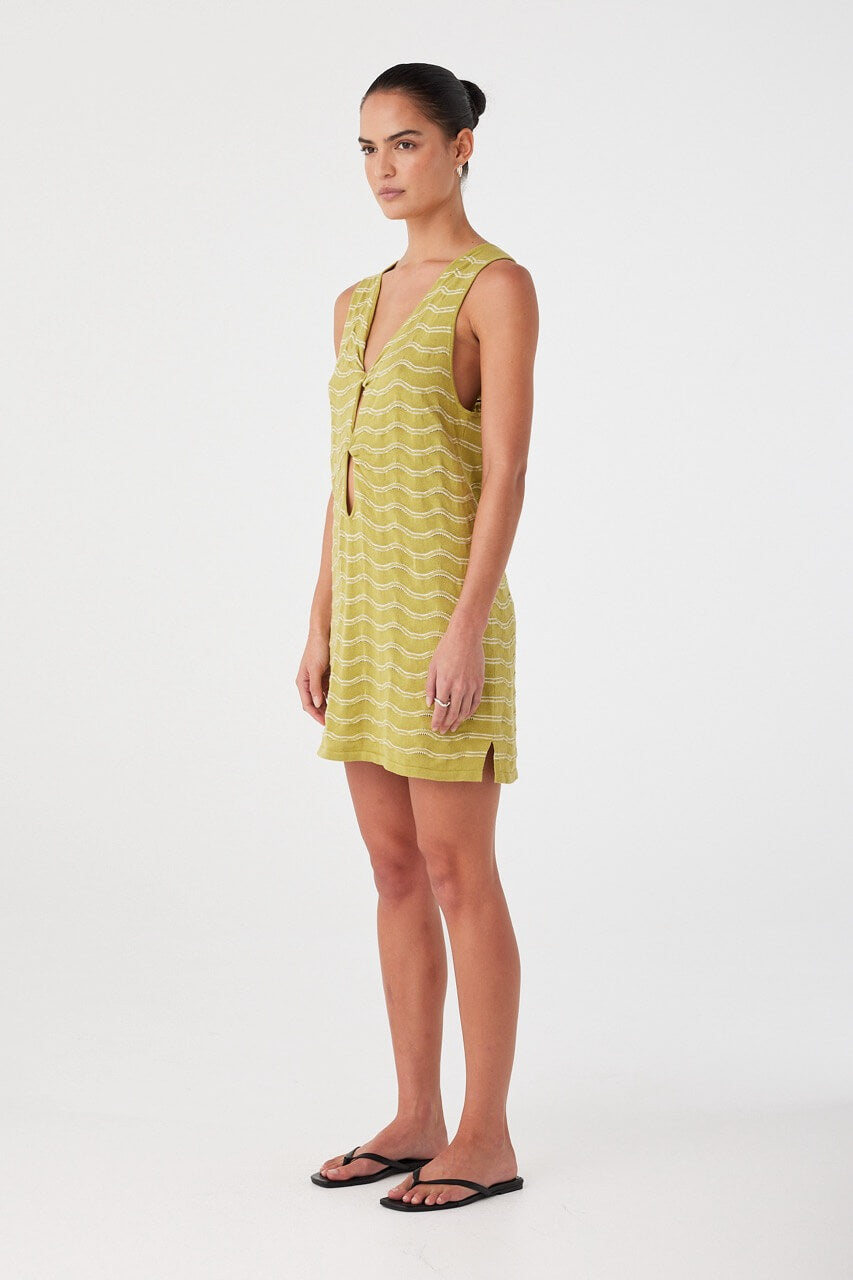 Side profile of textured mini dress in matcha wave knit. Lightweight with relaxed drape and twist-front keyhole detail.