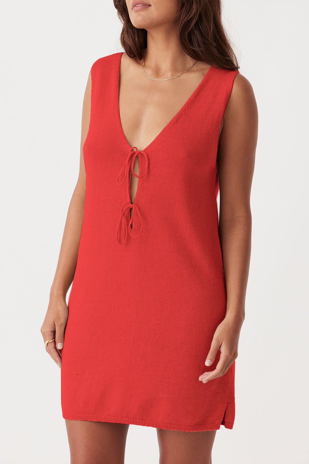 Side view of Poppy Mini Dress in hibiscus, featuring delicate tie details and relaxed fit in sustainable organic cotton-linen fabric