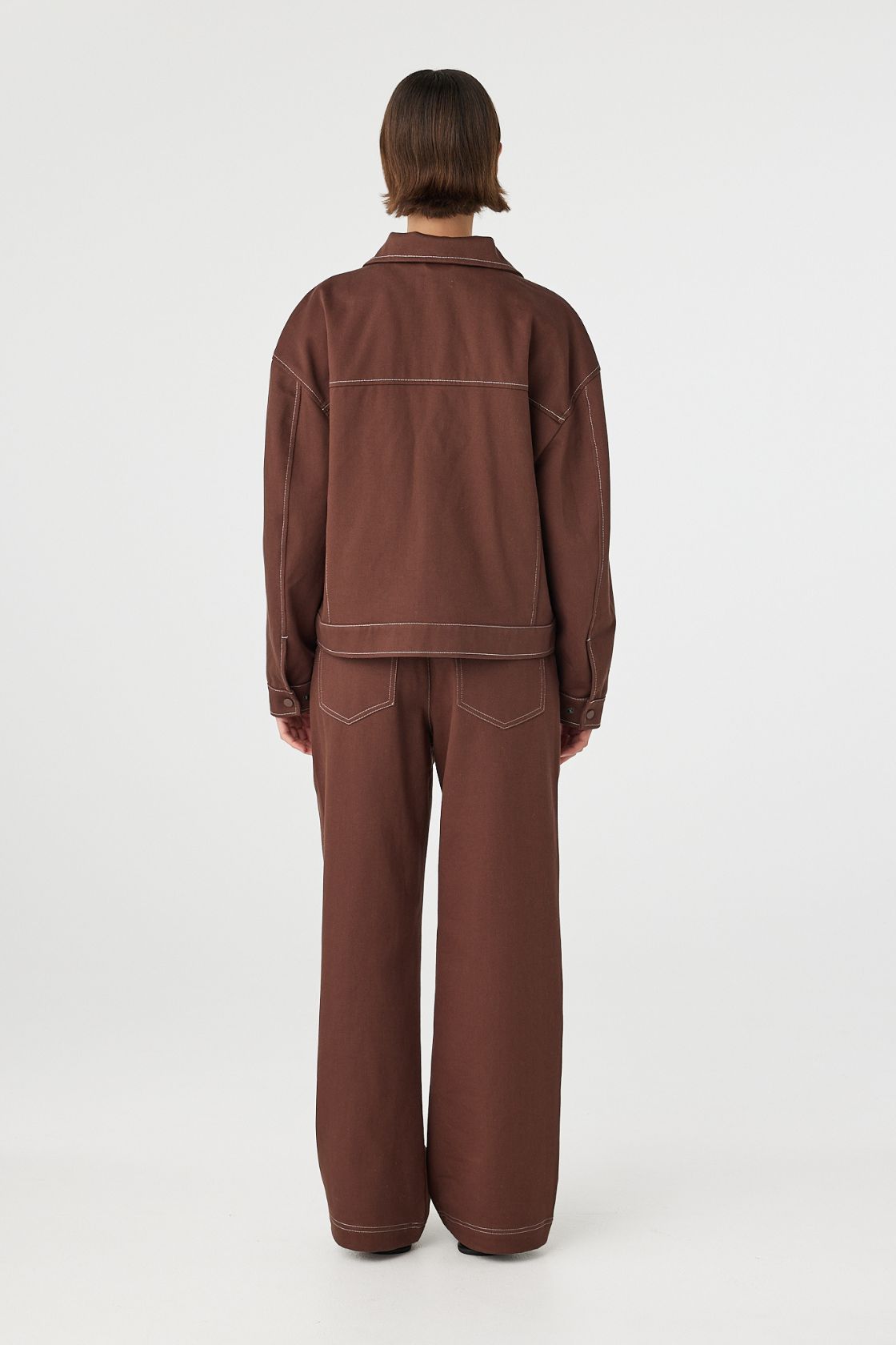 Back view of brown jacket with relaxed shape