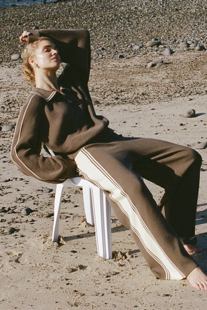 Pavement knit pants with contrast side stripe worn outdoors on the beach
