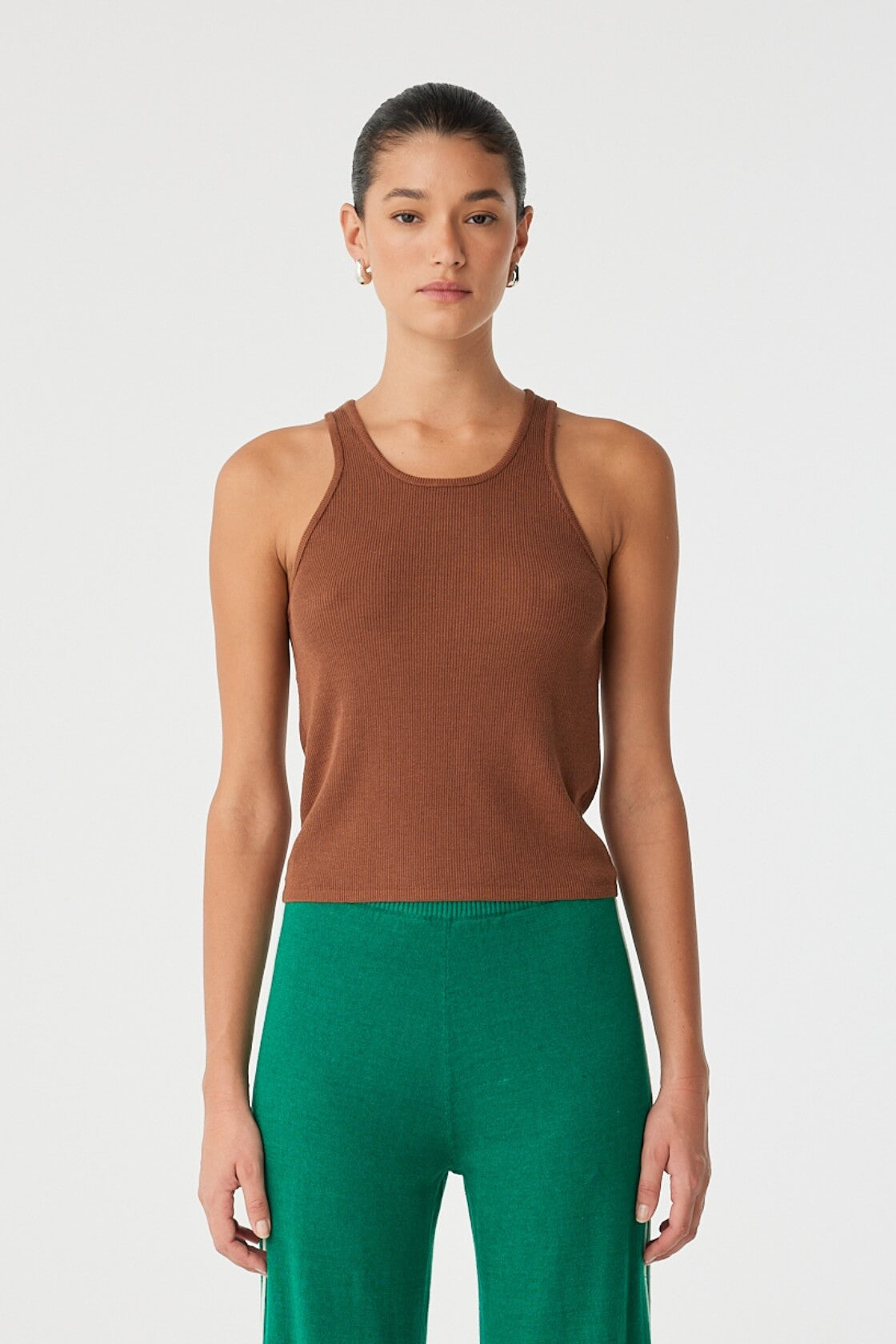 Front view of ribbed clay racer tank in organic cotton–hemp blend with bound neckline.
