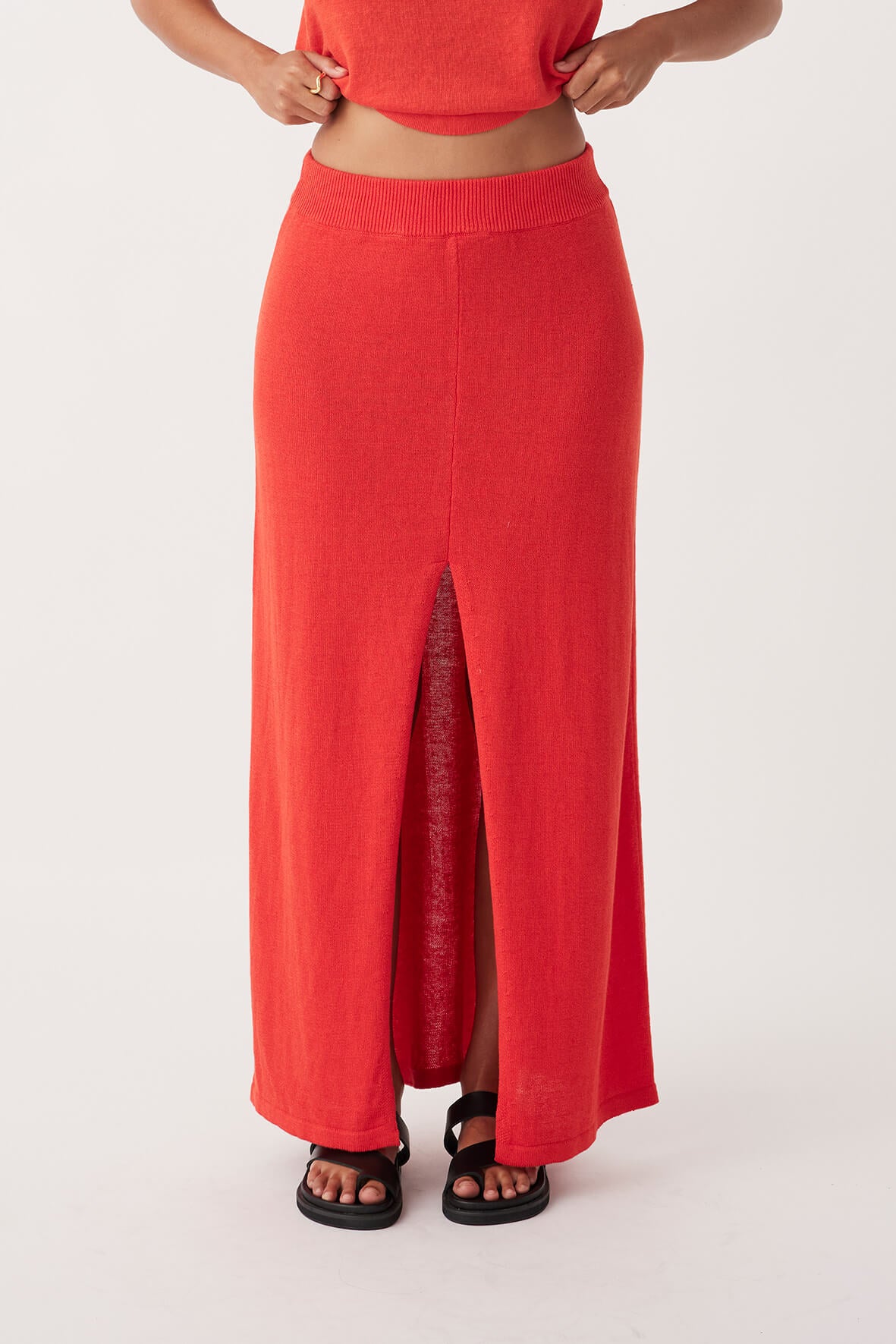 Front view of Poppy Skirt in hibiscus, A-line style with centre front split detail, made from organic cotton-linen blend.