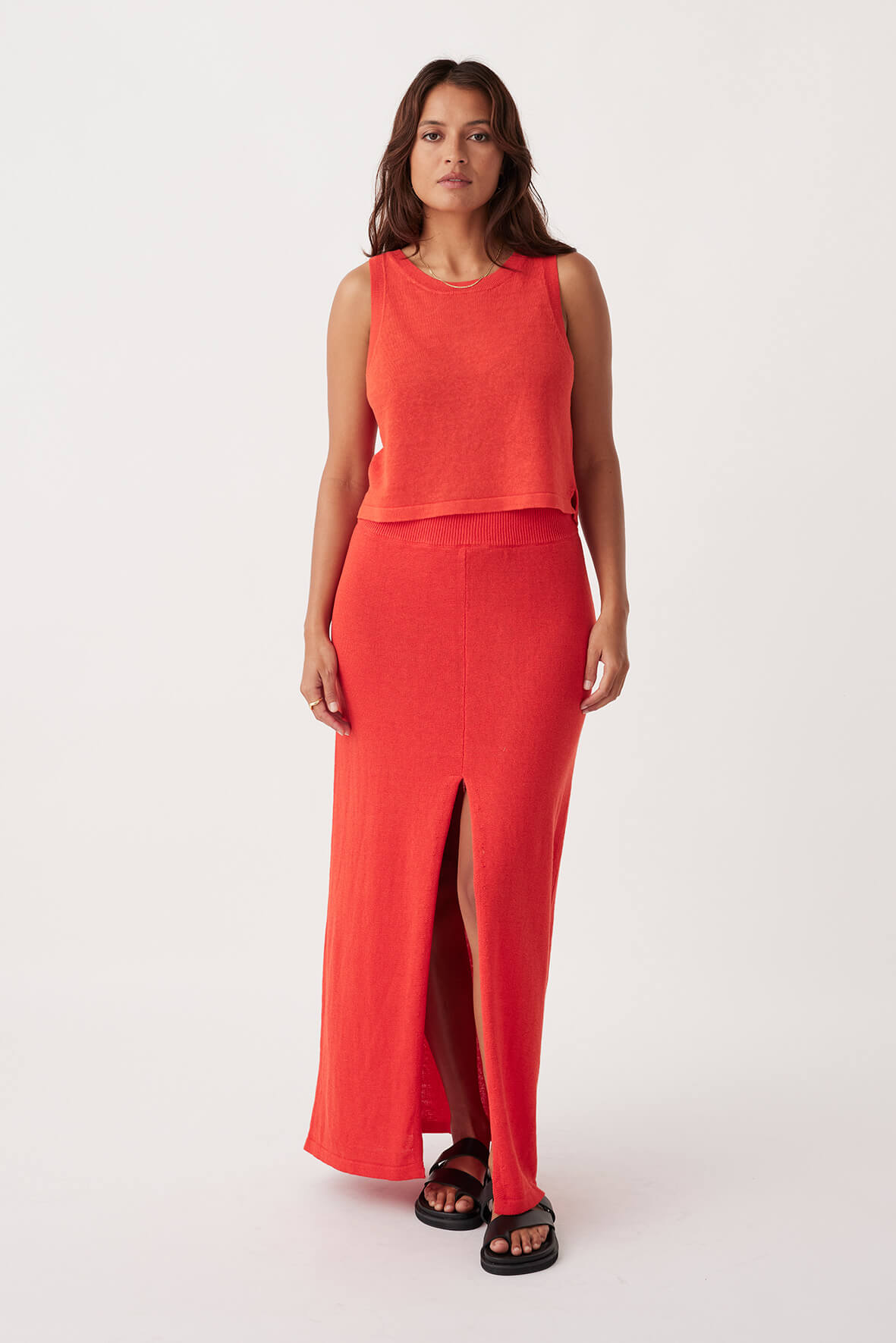 Full-body shot of Poppy Skirt in hibiscus, A-line style with centre front split, crafted from organic cotton-linen blend for sustainable fashion.