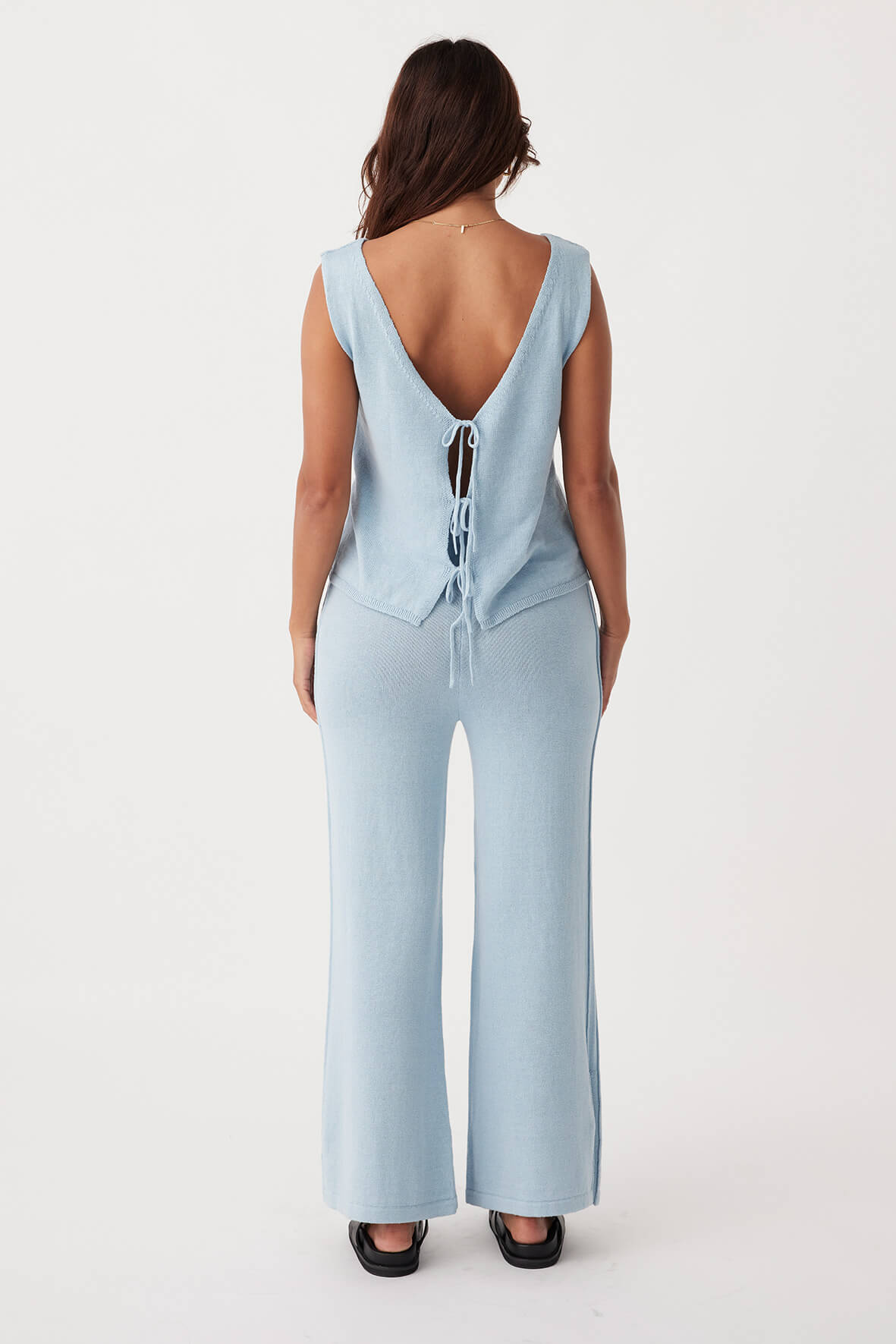 ull-body back view of Poppy Vest in sky, featuring a relaxed cropped fit and reversible design, made from organic cotton-linen blend for sustainable style.