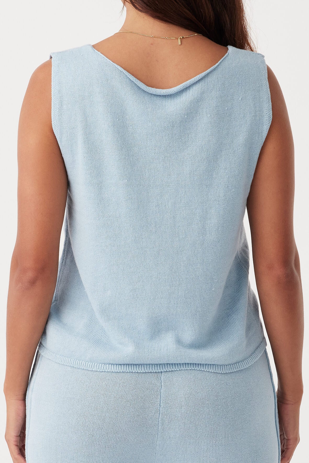 Back view of Poppy Vest in sky, relaxed cropped fit with tie detail, ethically produced from organic cotton-linen blend