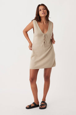 Full-body shot of Poppy Mini Dress in taupe, featuring a relaxed fit, V-neck design, and delicate tie details, made from a sustainable organic cotton-linen blend for eco-conscious style