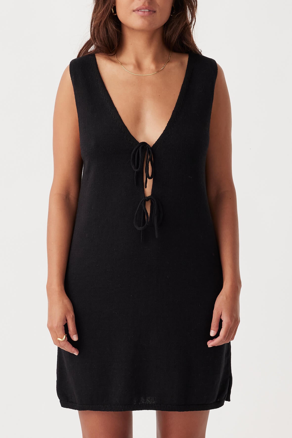 Front view of the Poppy Mini Dress in Black, featuring a deep V-neckline and delicate tie details, crafted from a sustainable organic cotton-linen blend.