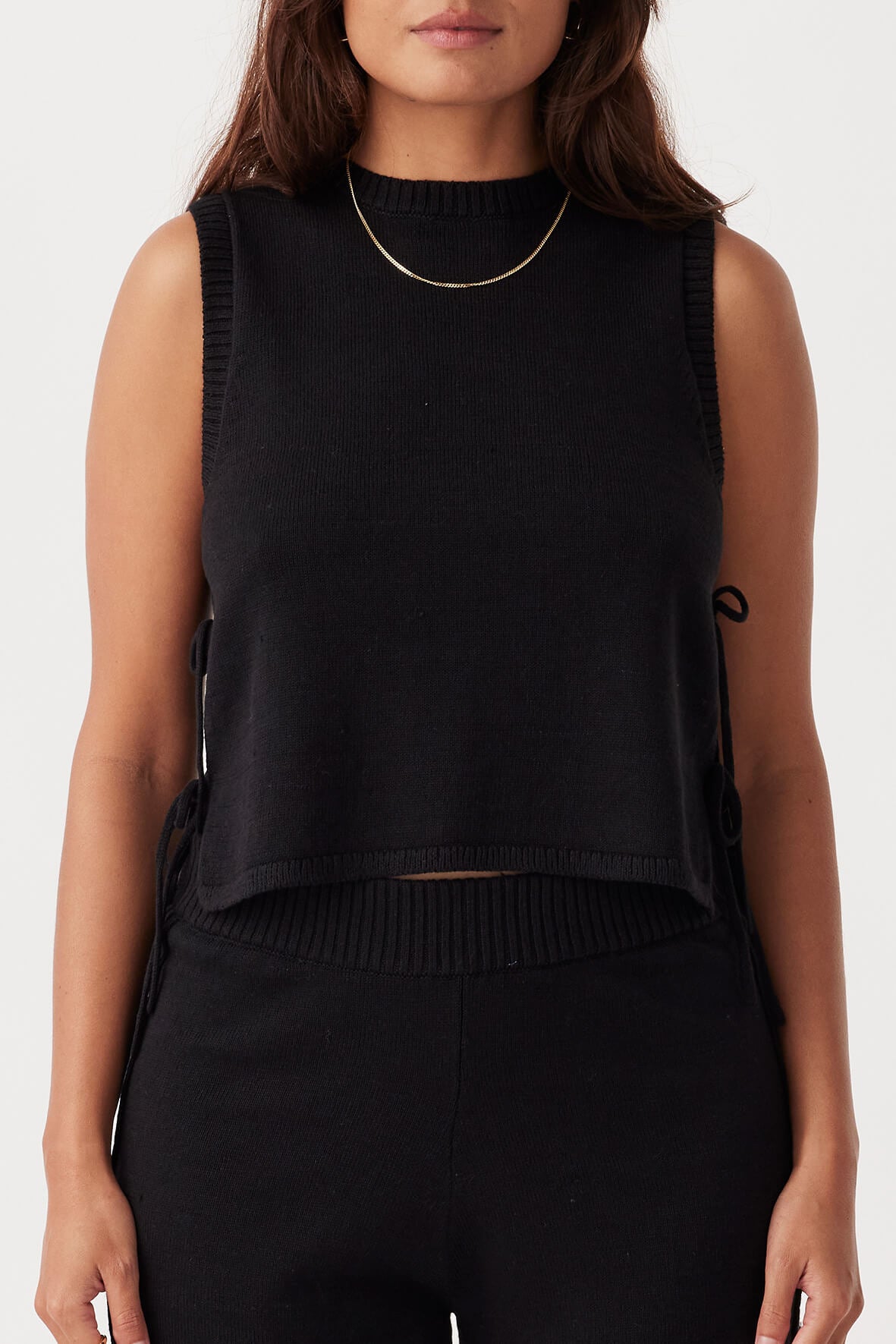 Front view of Poppy Tank in black, cropped boxy fit with round crew neckline, made from linen-organic cotton blend.