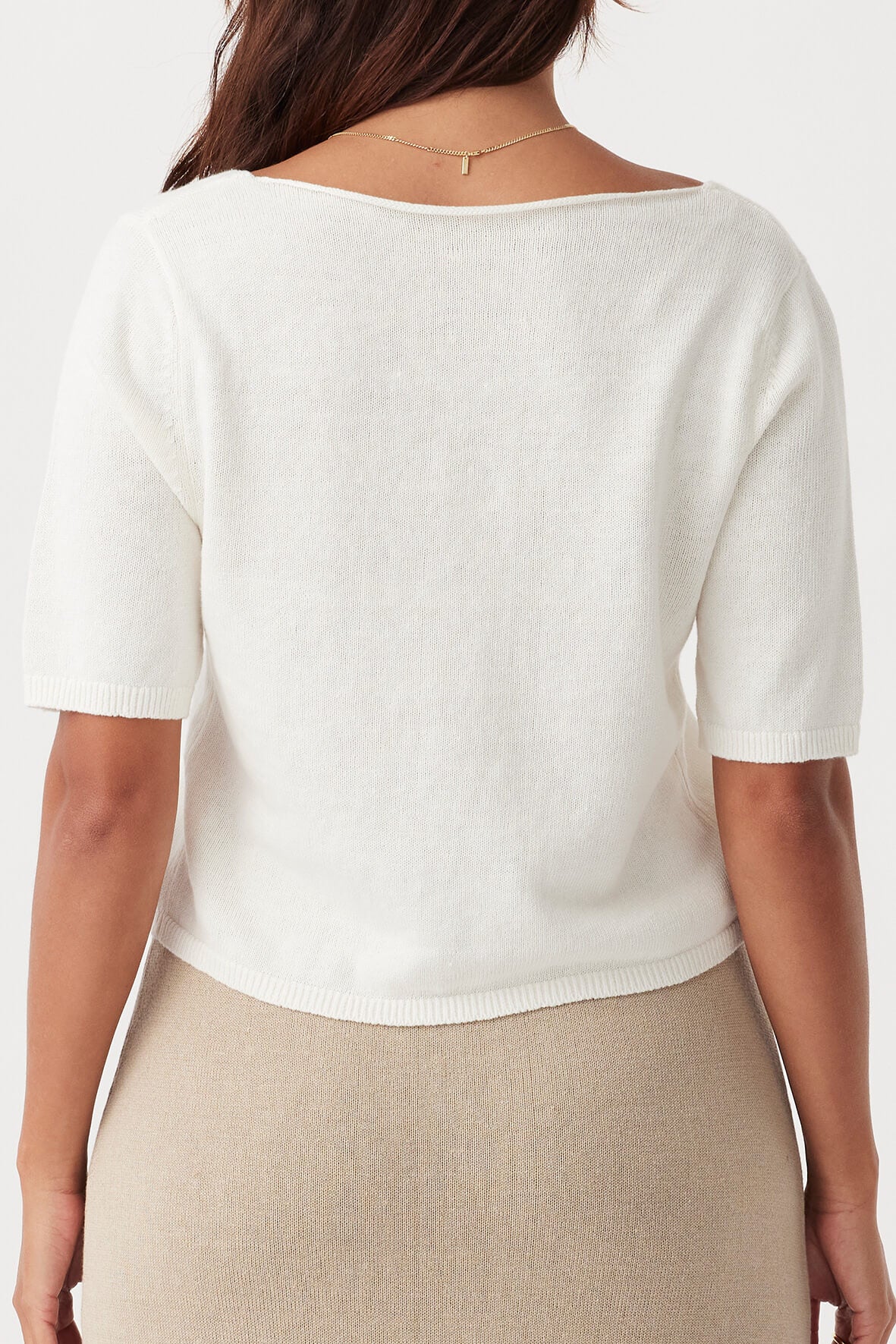 Back view of the Poppy Short Sleeve Top in Cream, highlighting its clean, minimalist design and soft eco-friendly material.