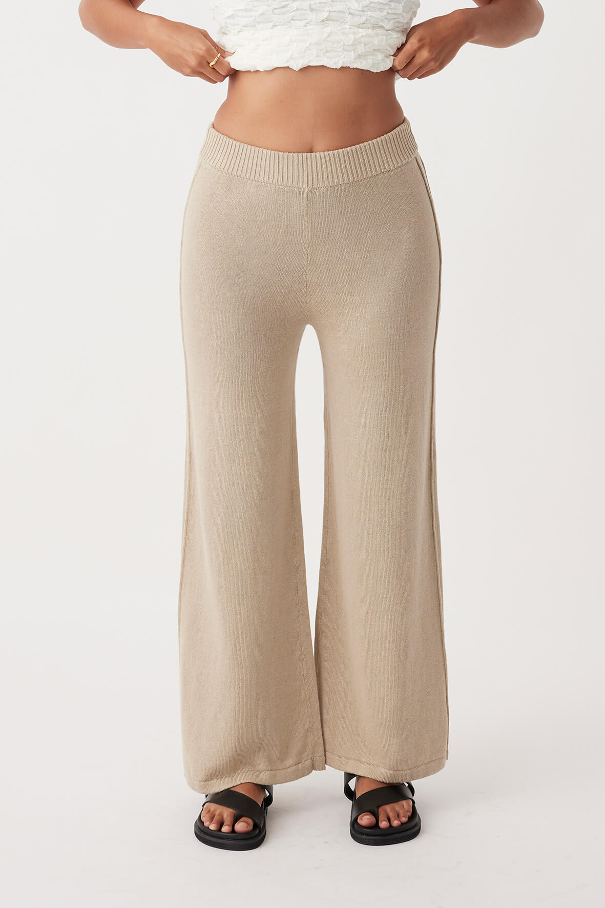 Front view of Poppy Pant, relaxed fit with ribbed elastic waist, pleats, and ties, made from lightweight organic cotton-linen blend.