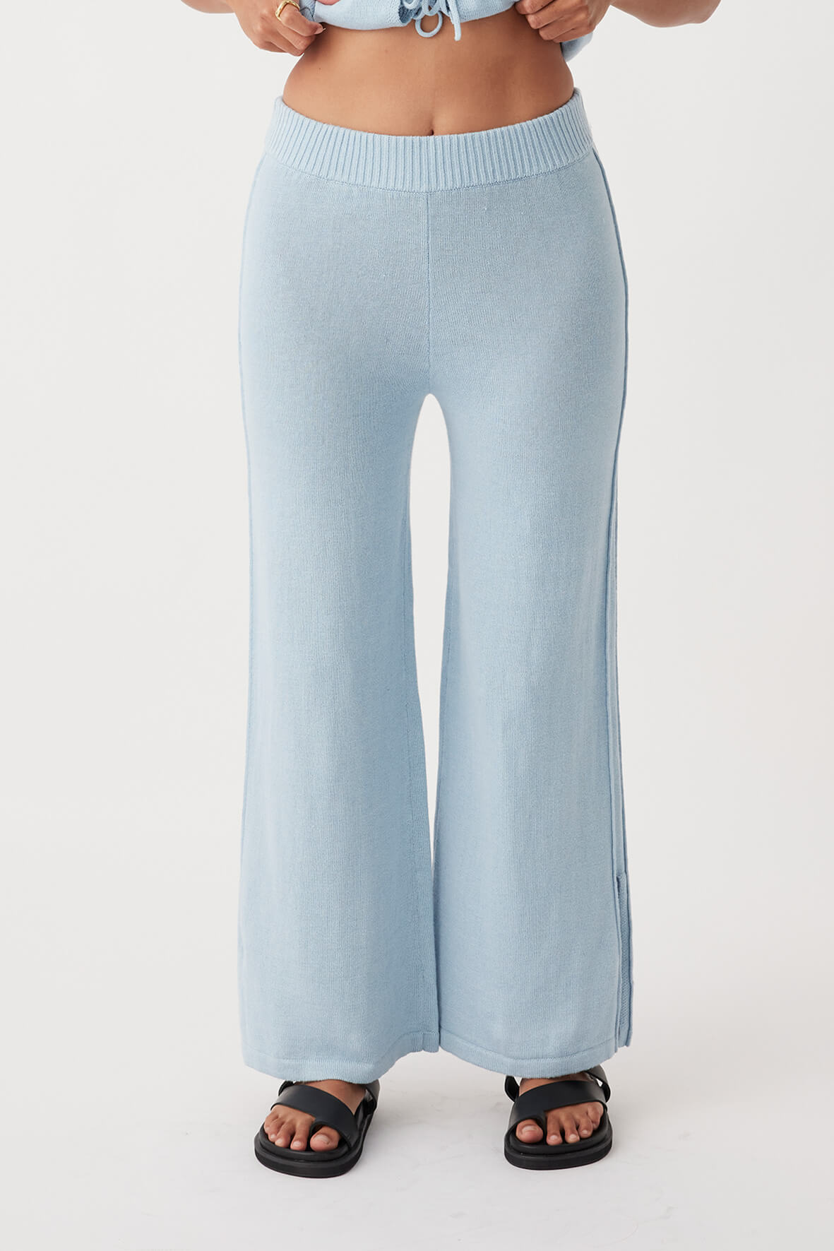 Front view of Poppy Pant in sky, relaxed wide-leg fit with side pleats and ribbed elastic waistband, crafted from organic cotton-linen blend.