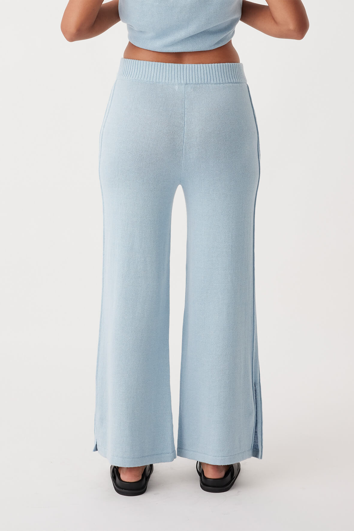 Back view of Poppy Pant in sky, featuring relaxed wide-leg fit and ethically produced from lightweight organic cotton and linen blend.