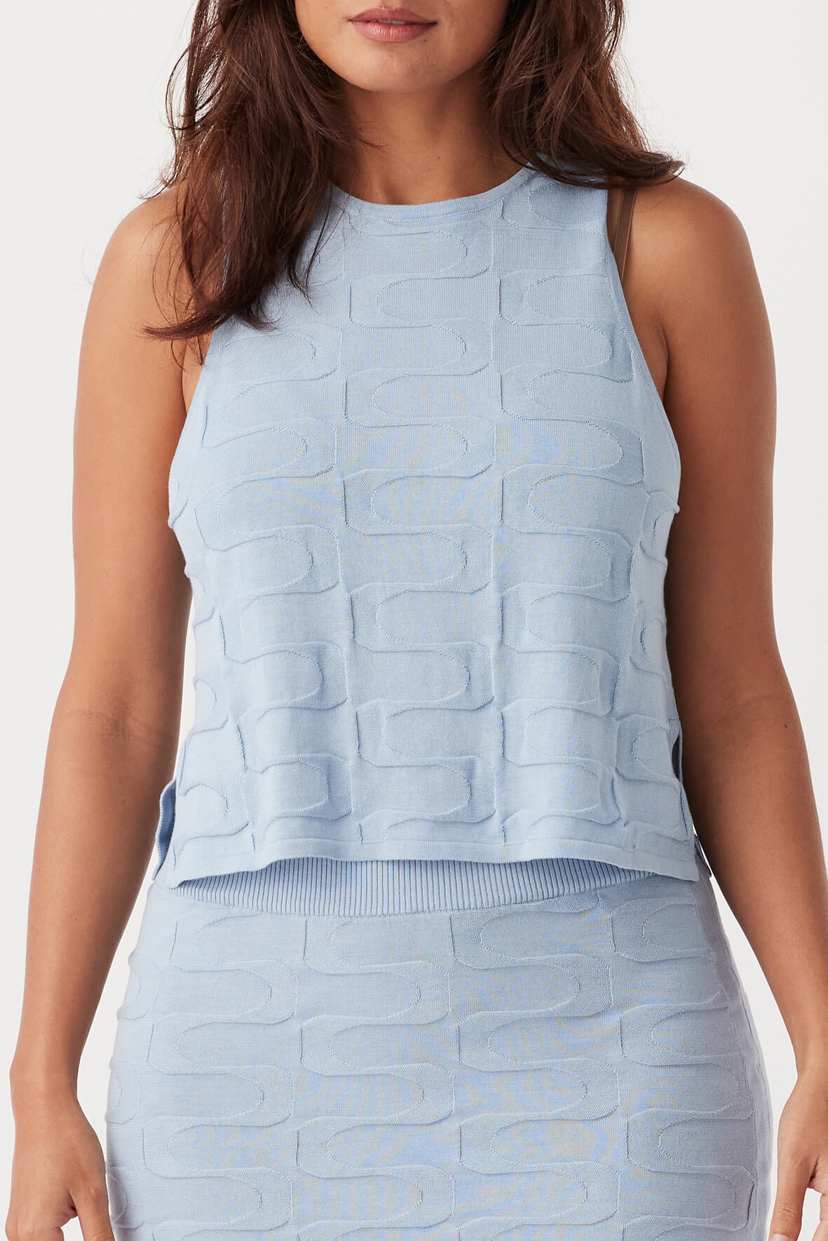 Front view of Lara Tank in sky, cropped boxy fit with high crew neckline and side splits, made from organic cotton jacquard knit.