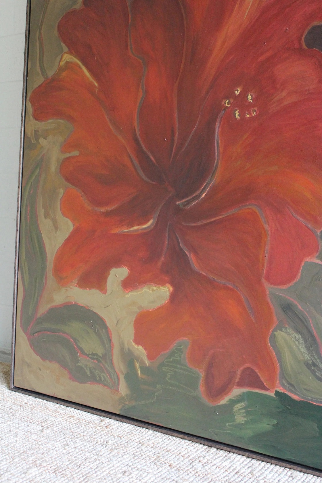 Close-up of a painting of a red flower with green leaves on a textured surface.