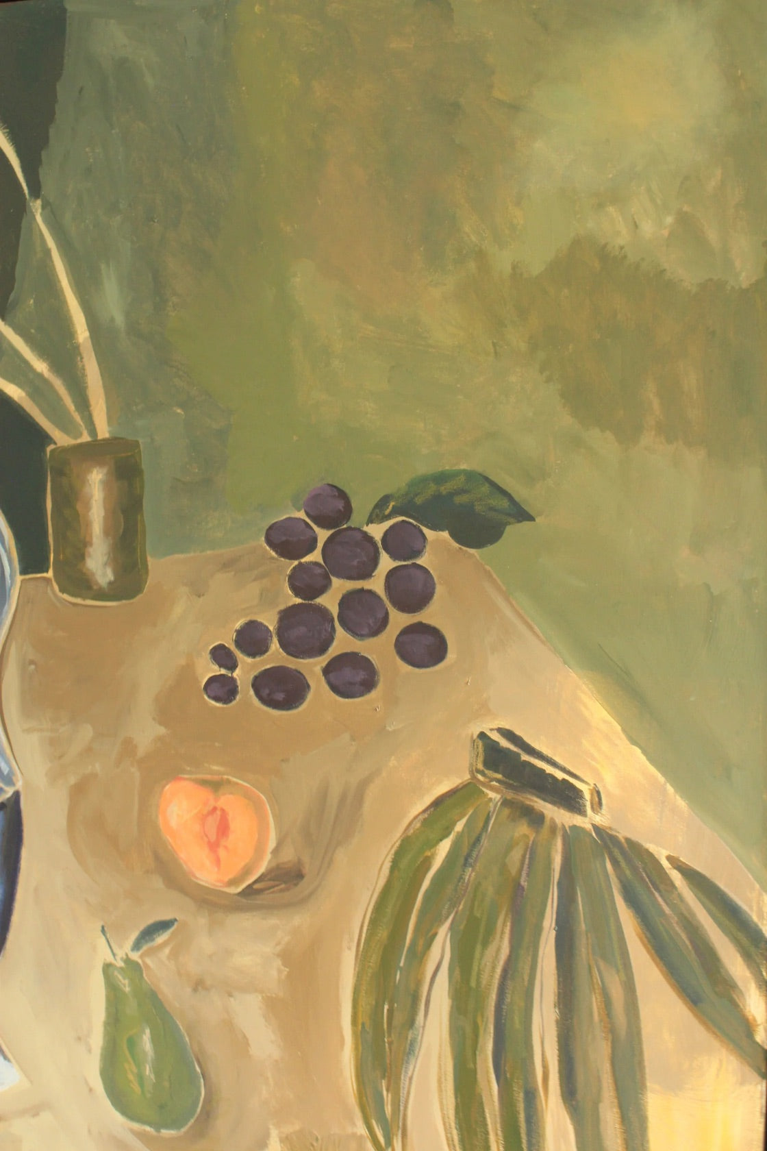A still life painting depicting dark purple grapes, a peach, a pear, and a bunch of bananas on a table against a textured olive green background.