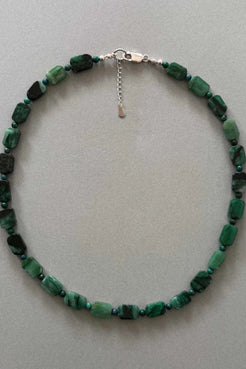 This item is one-of-one and truly unique. Handcrafted using natural green muscovite beads, strung against lapis stones and layered together in deep green tones.