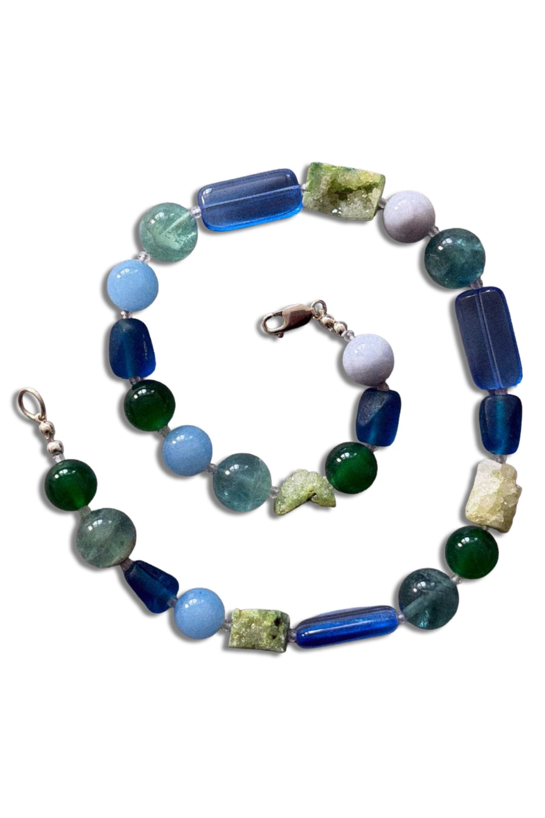 A beaded necklace and matching bracelet set made of mixed gemstone beads in shades of blue, green, and light aqua, with silver-toned clasps, shown on a plain white background.