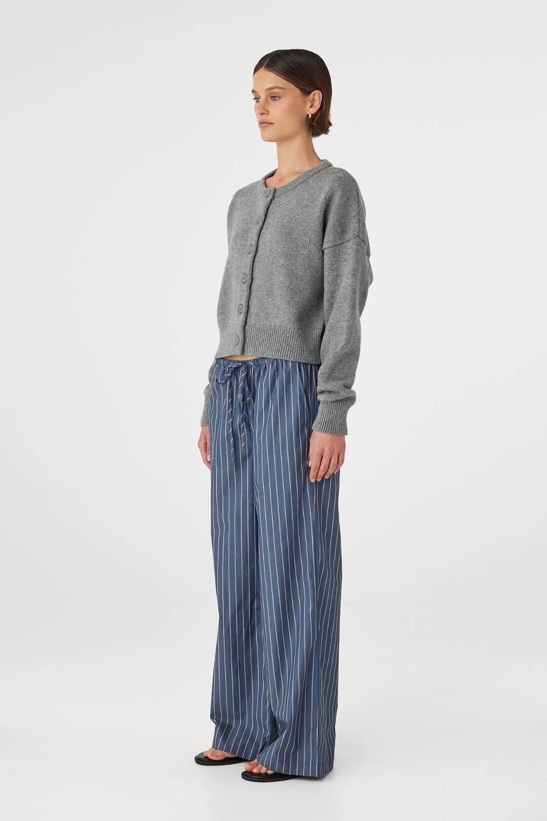 Outfit view of Rae Pant muted blue stripe styled with grey cardigan, straight-leg cotton pants with elastic waist.