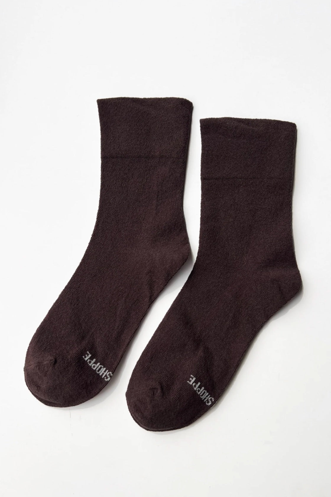 Pair of brown socks on a white background