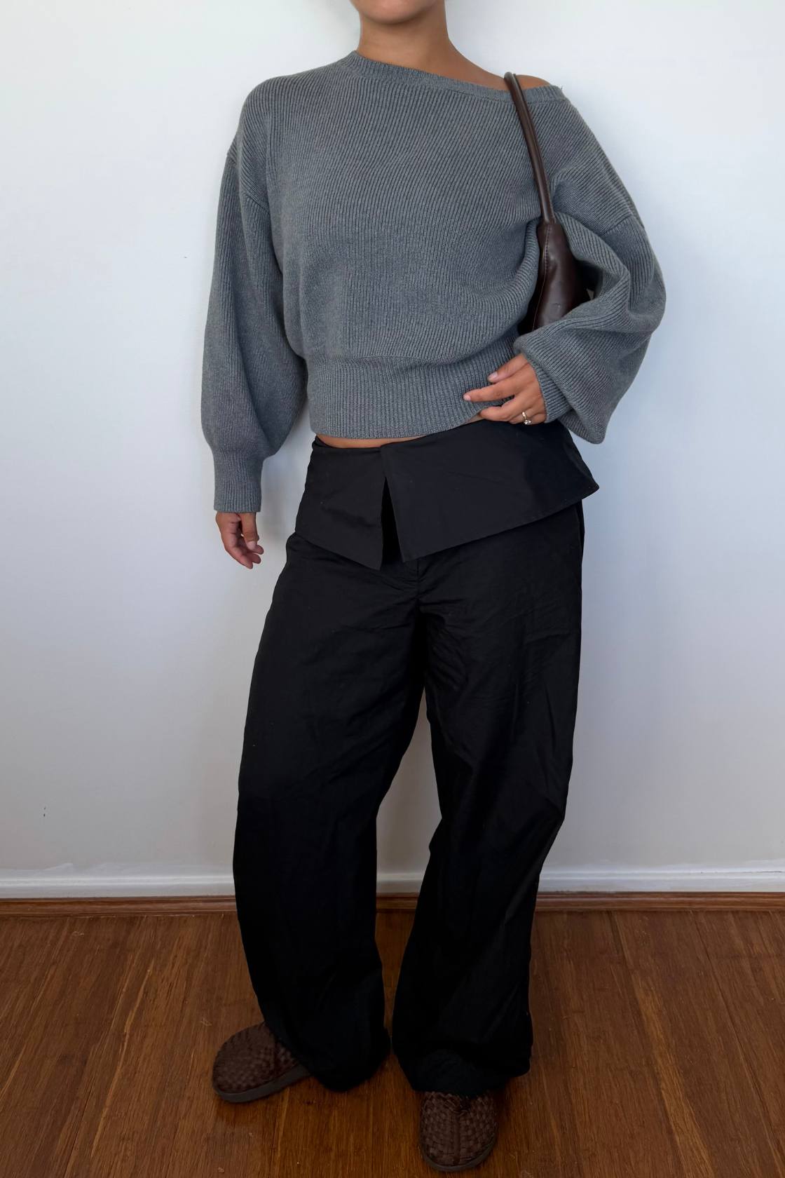 Grey marle knit sweater with relaxed fit paired with black pants