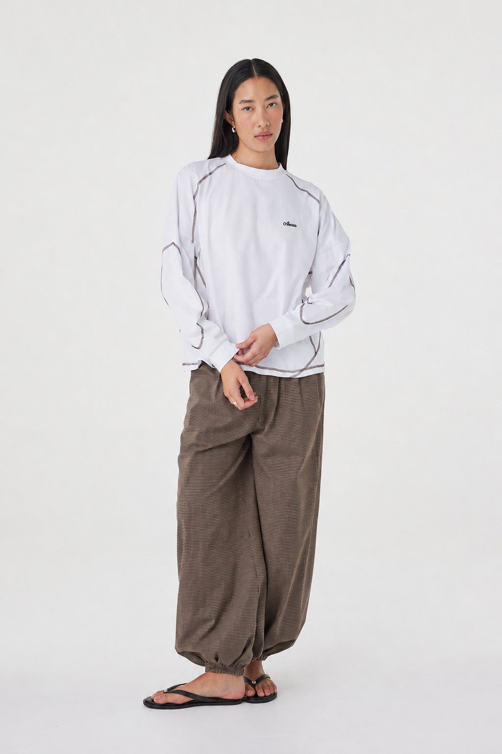 Full-length front view of the Kesh LS Tee in Cream & Espresso showcasing the relaxed fit, long sleeves and contrast stitching