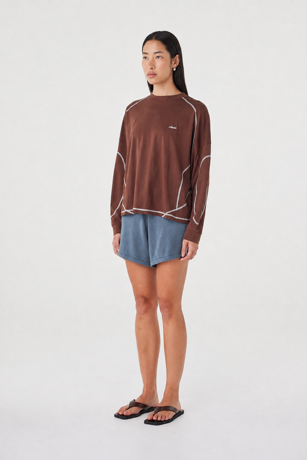 Side view of the Kesh LS Tee in Espresso & Cream featuring the relaxed off-body silhouette, ribbed cuffs and contrast seam detailing.