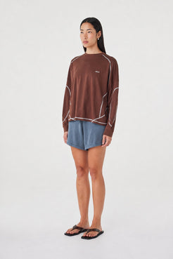 Side view of the Kesh LS Tee in Espresso & Cream featuring the relaxed off-body silhouette, ribbed cuffs and contrast seam detailing.