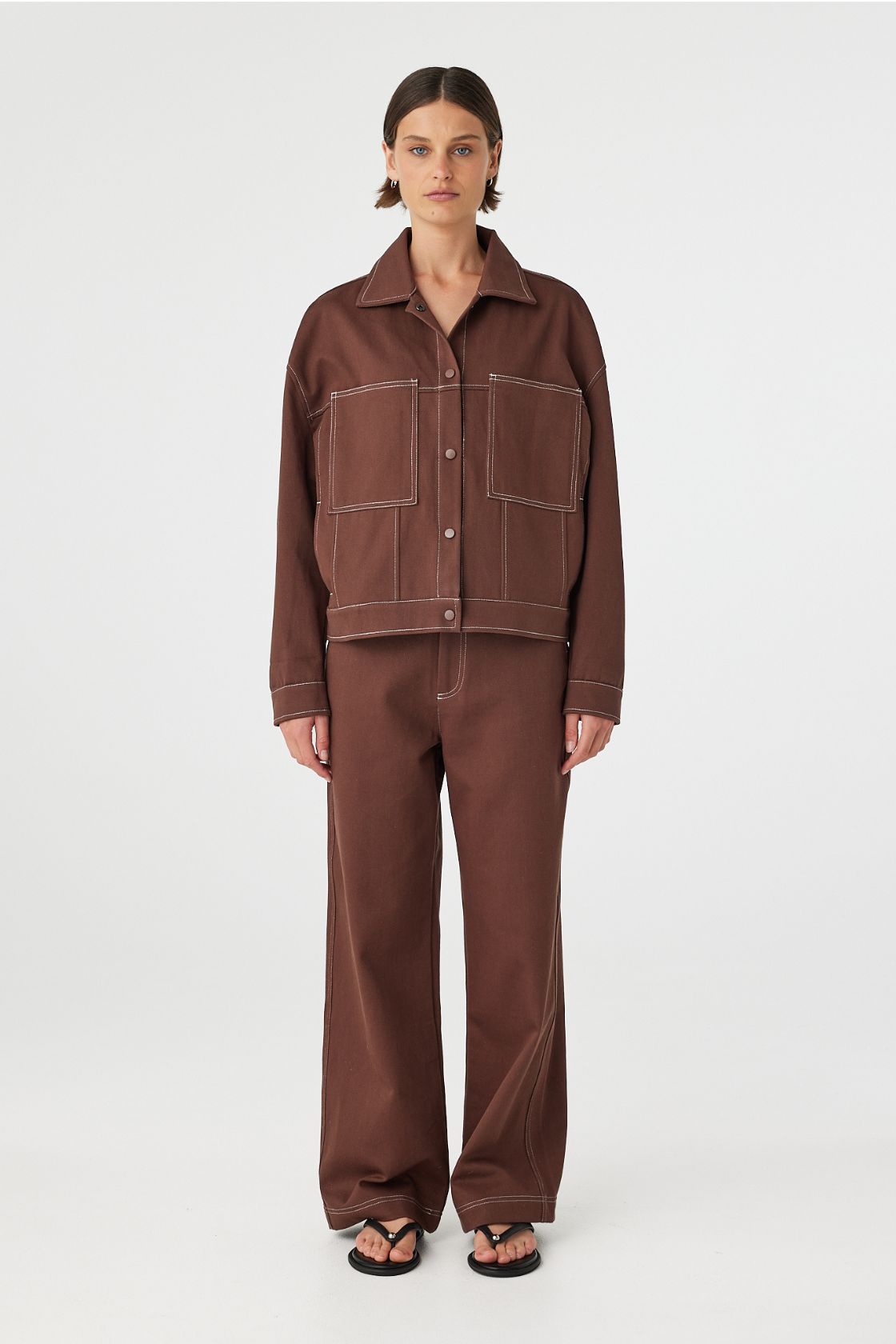 Full body front view of brown jacket with matching pants