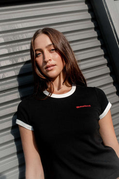 Contrast neck binding detail on black and off white tee