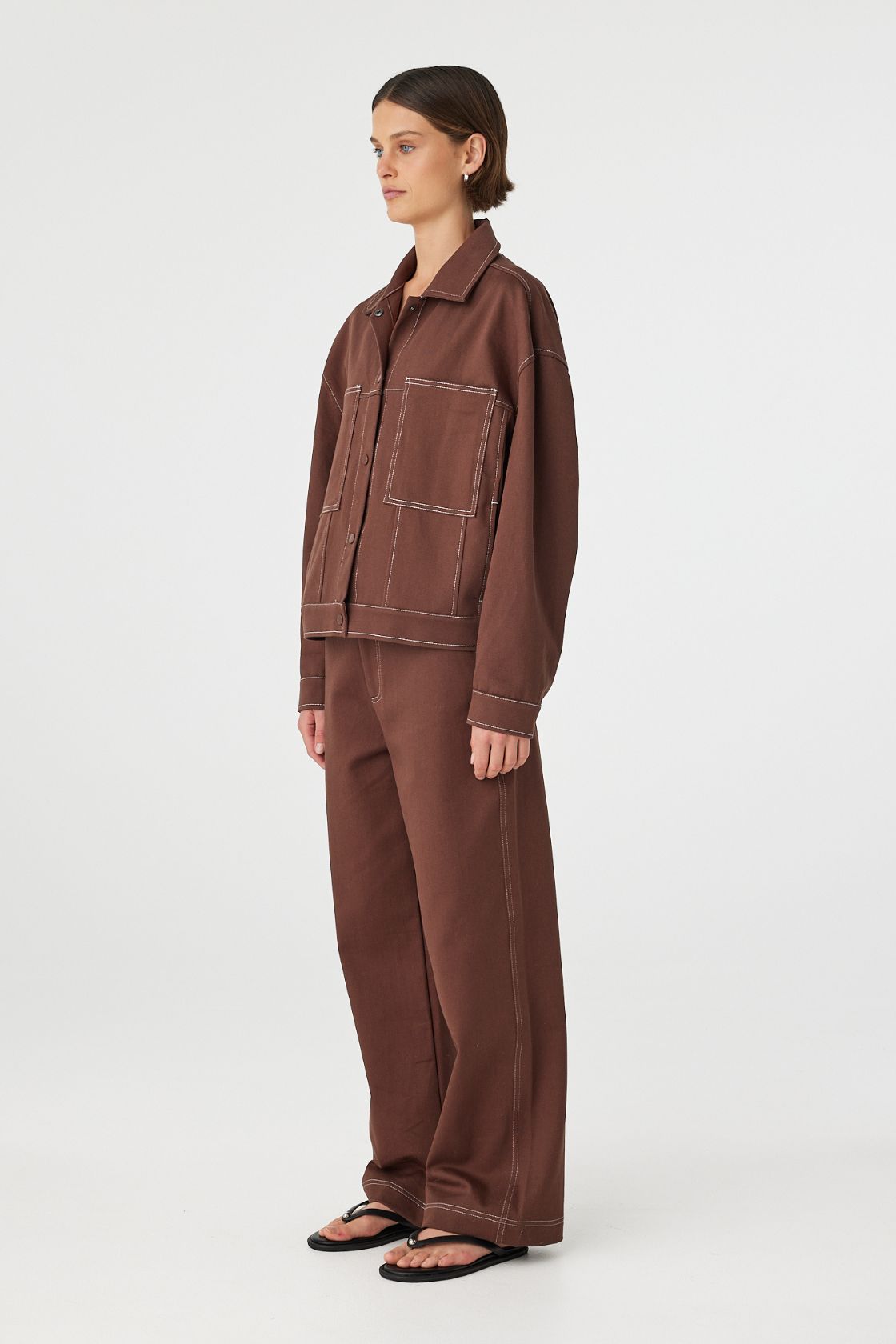 Side view of brown jacket showing boxy fit