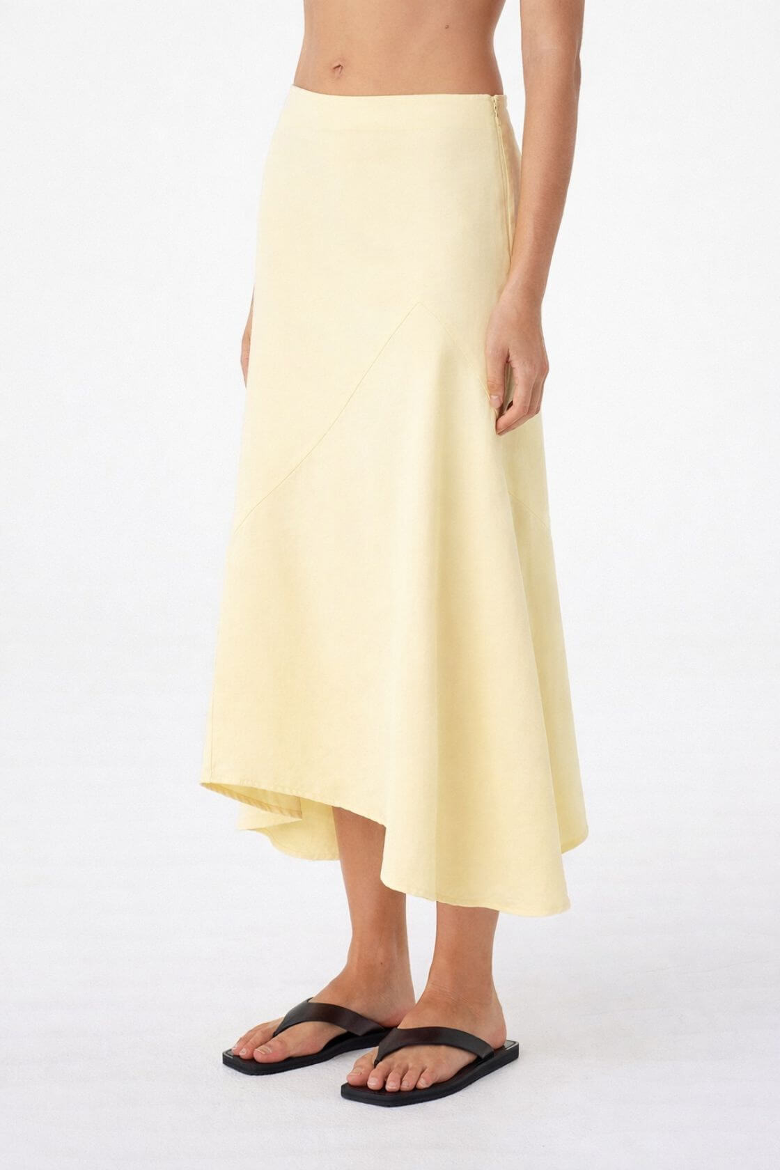 Alessia Skirt Butter, side view showing asymmetric hem