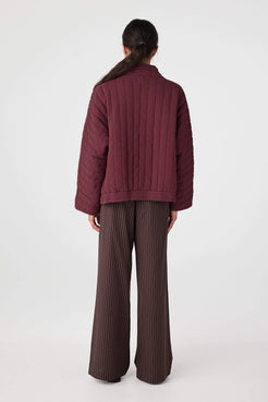 Back view of Merlot quilted jacket showing relaxed width and quilted stitching pattern