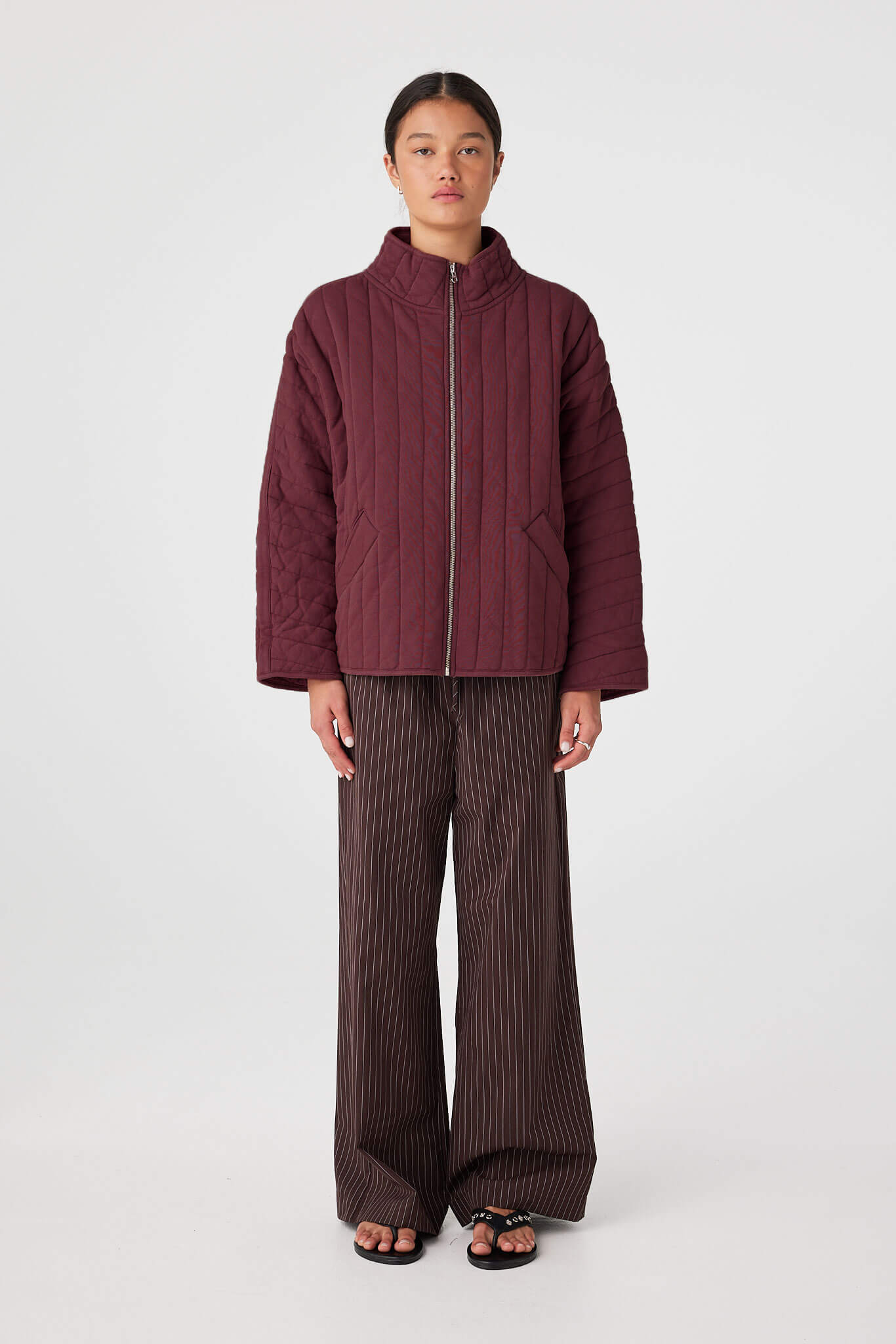 Merlot quilted zip jacket layered over tank top for air-conditioned spaces and travel