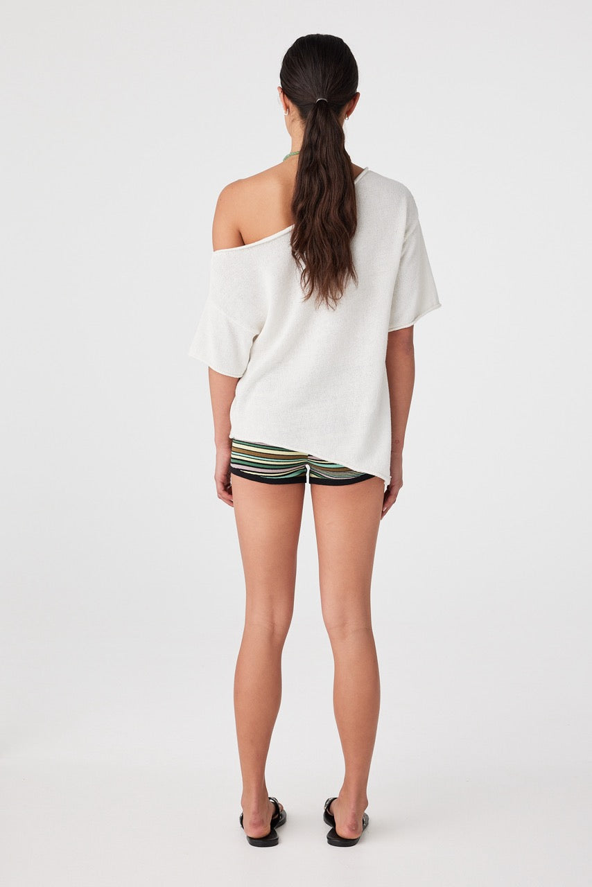 Back view of cream short sleeve knit tee with off-shoulder neckline