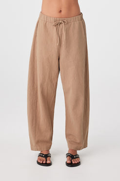 Close front view of pecan barrel-leg pants showing elasticated waistband with drawstring