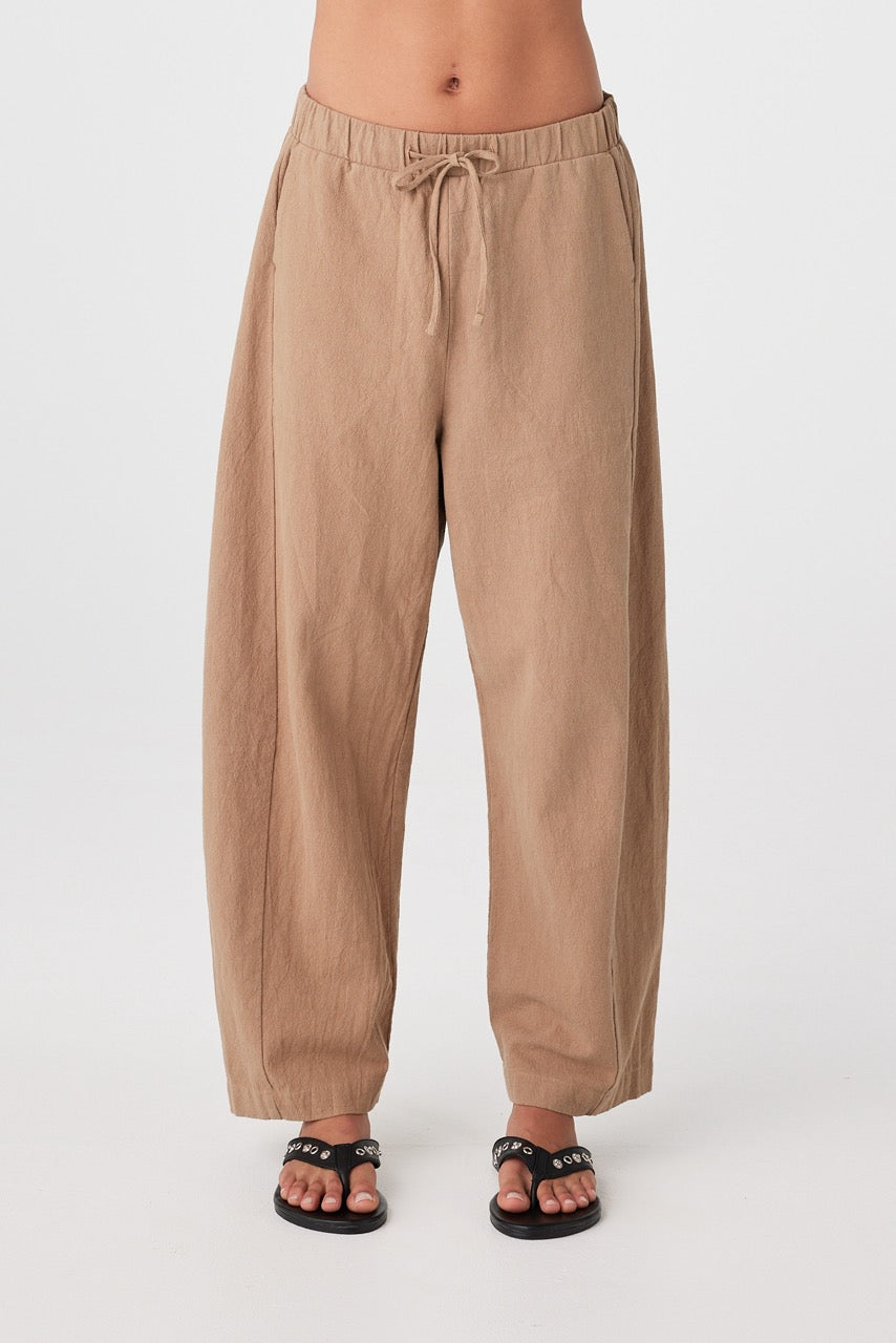 Close front view of pecan barrel-leg pants showing elasticated waistband with drawstring