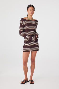 Front view of model wearing sheer espresso stripe long-sleeve mini dress over swim