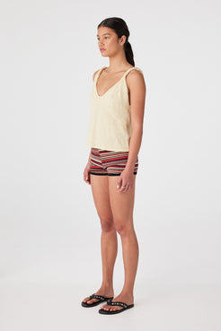 Side profile showing wide leg fit and custom stripe pattern on soft cotton knit fabric