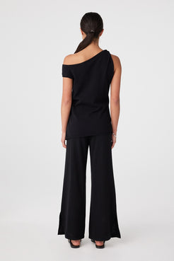 Back view of black relaxed wide-leg pants with elastic waistband