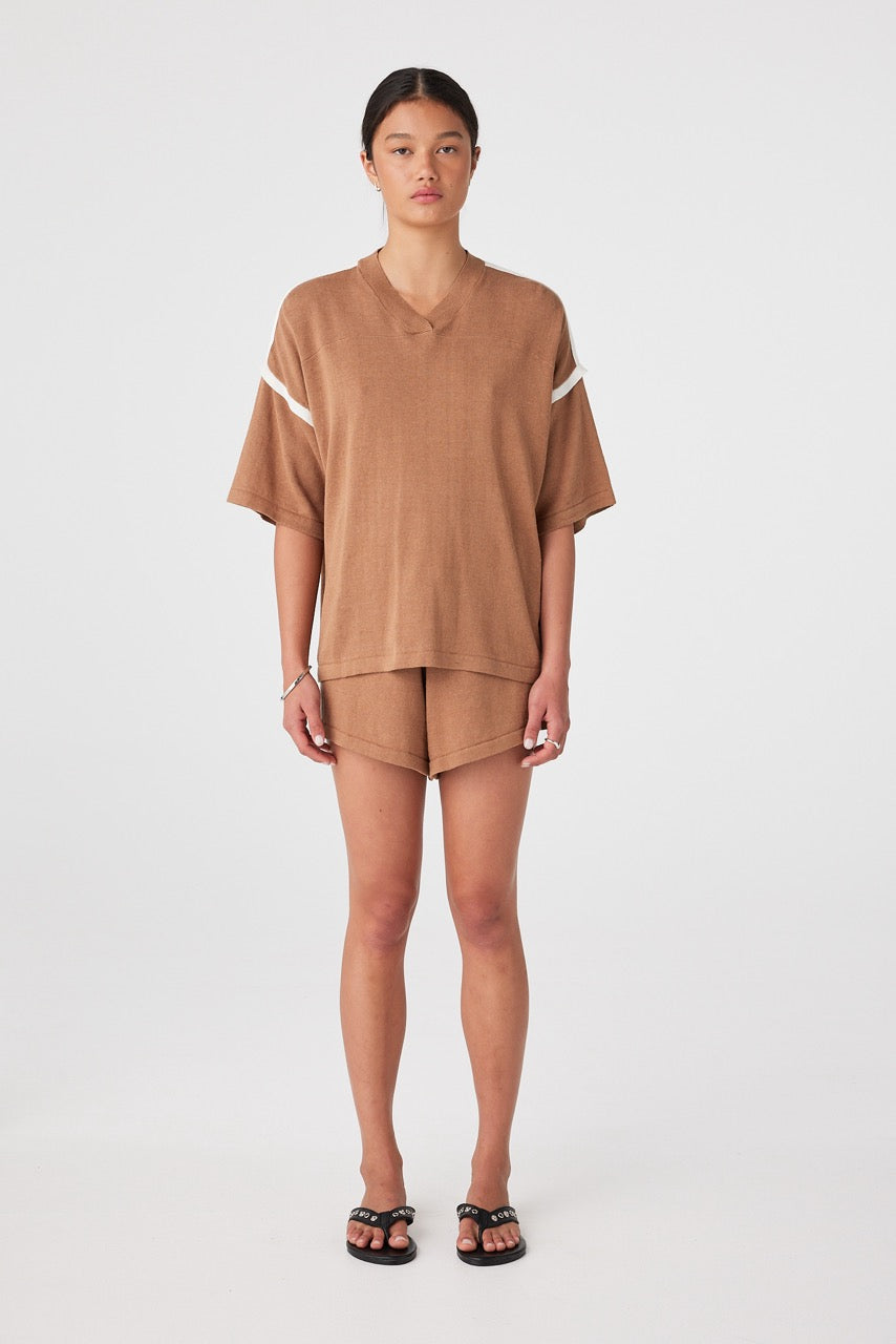 Front view of model wearing relaxed pecan drawcord shorts with contrast side panel and matching tee