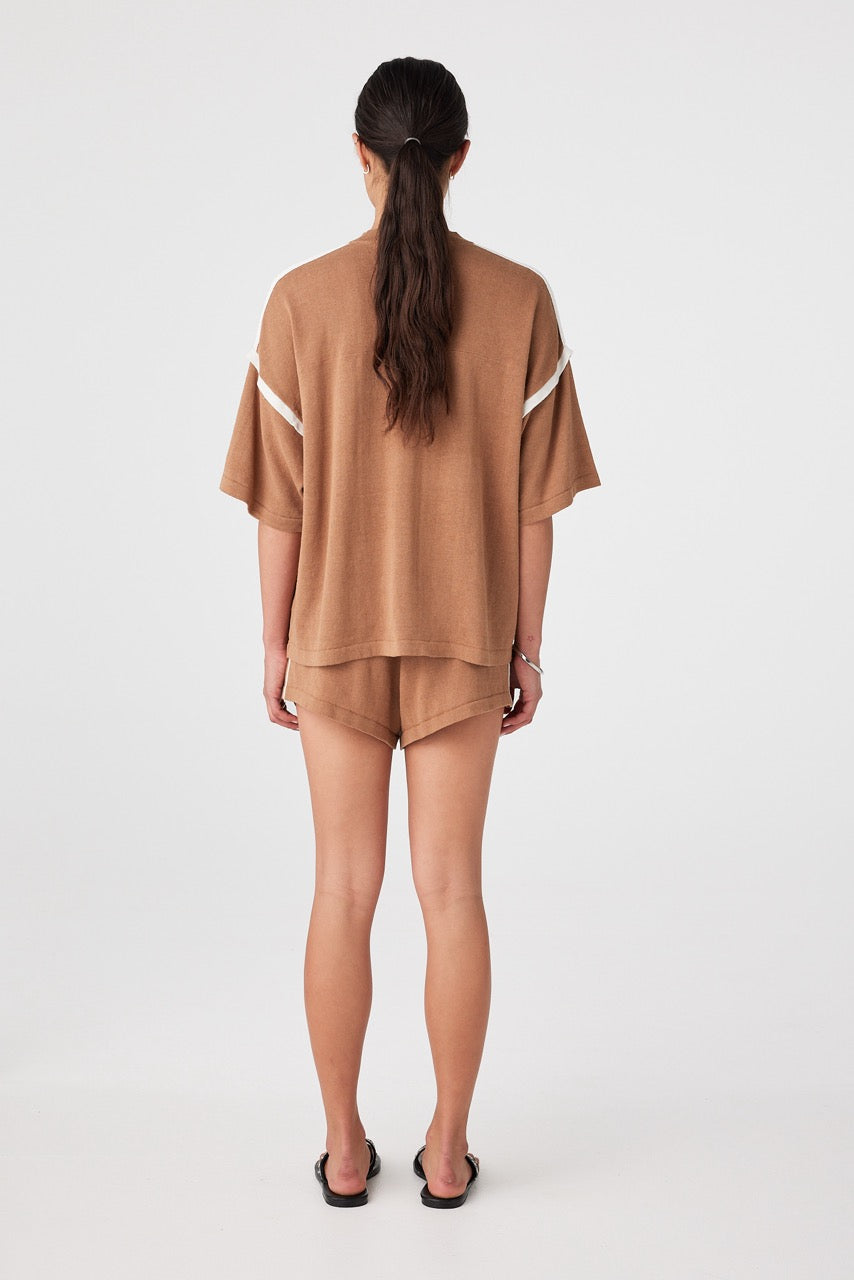 Back view of drawcord shorts in organic cotton-linen with straight leg and curved hem
