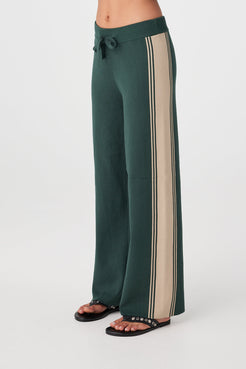 Close view of ribbed waistband with drawcord and contrasting tie on Forest pants