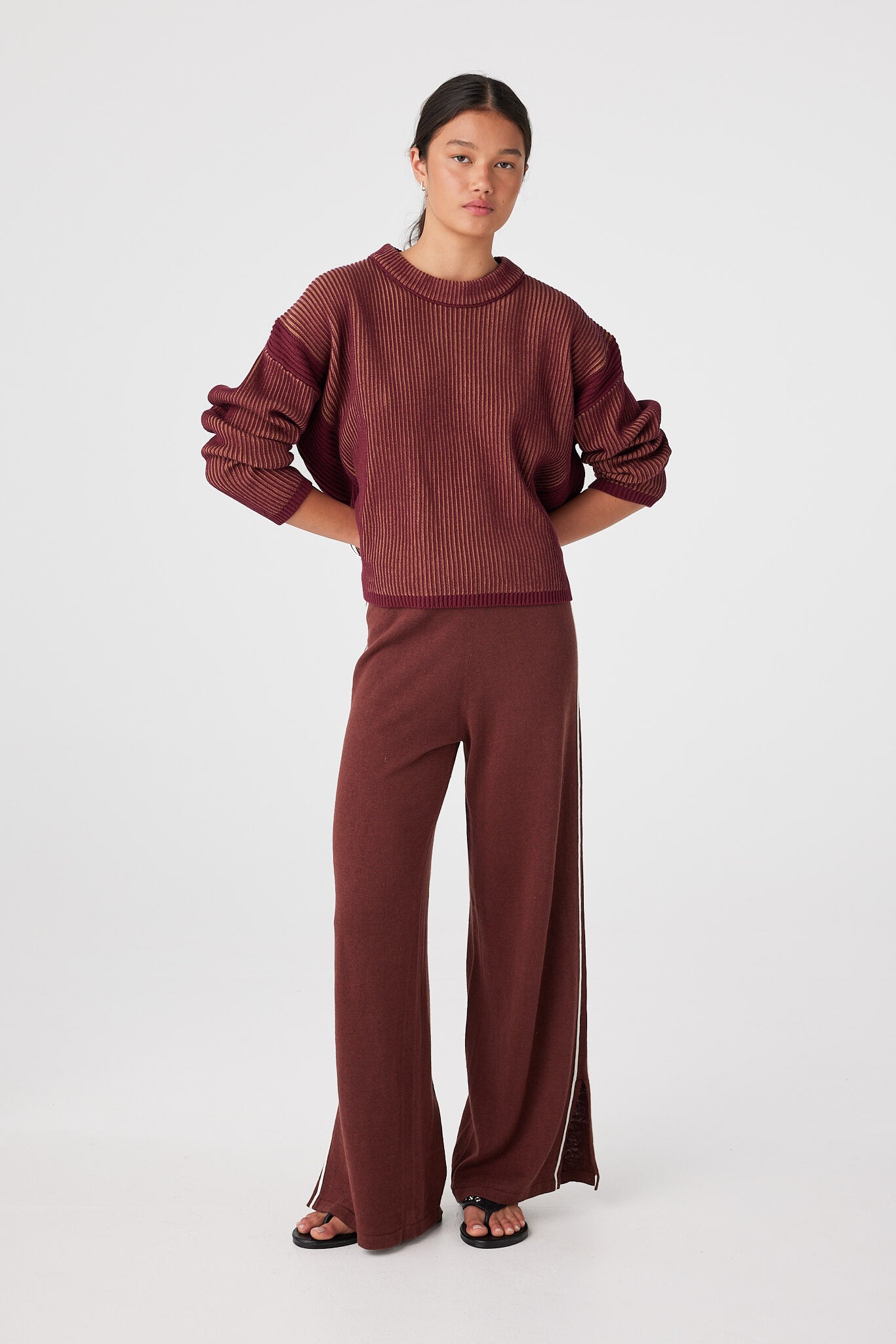 Styled look with matching pants highlighting breathable knit set for mild-to-cool weather